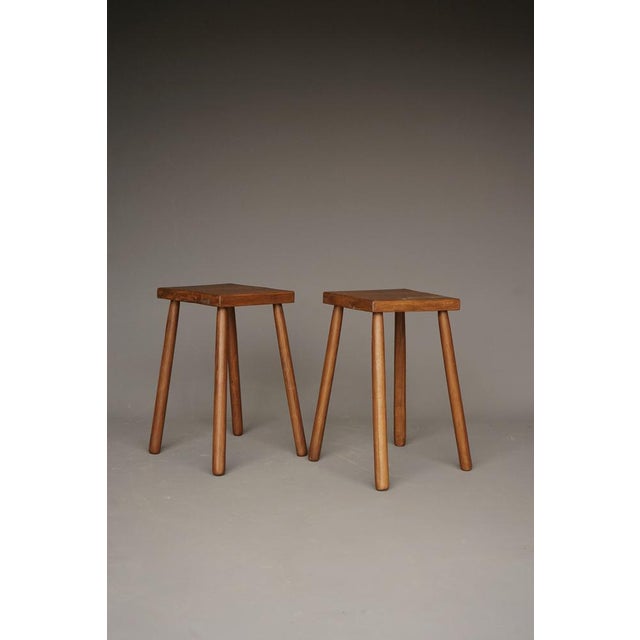 A pair of stools in solid oak. The unusual and desirable aspect of these stools is that they are much higher than most low...