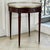 Created in the tradition of the celebrated French bouillotte table, this Louis XVI style example combines fine mahogany,...