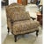 Traditional bergère styling is paired with an allover brown and gold paisley tapestry upholstery. The framed silhouette...