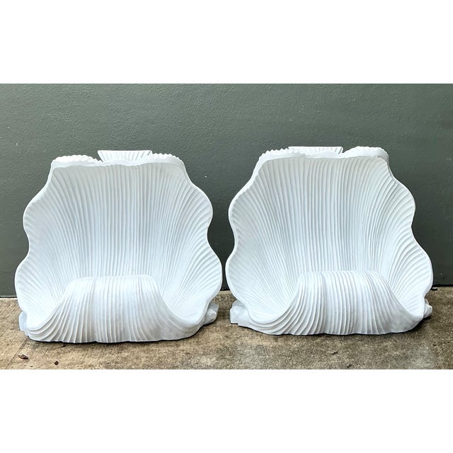 Sculpted to echo the scalloped form of a clam shell, this pair of vintage table pedestals brings organic, coastal glamour...