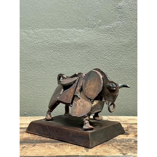 This remarkable Brutalist sculpture, titled "El Toro," is a masterwork of mid-century industrial art. Dated 1971, the...