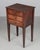A 19th Century Country French side table, or nightstand, made of solid walnut, with three dovetailed drawers with turned...