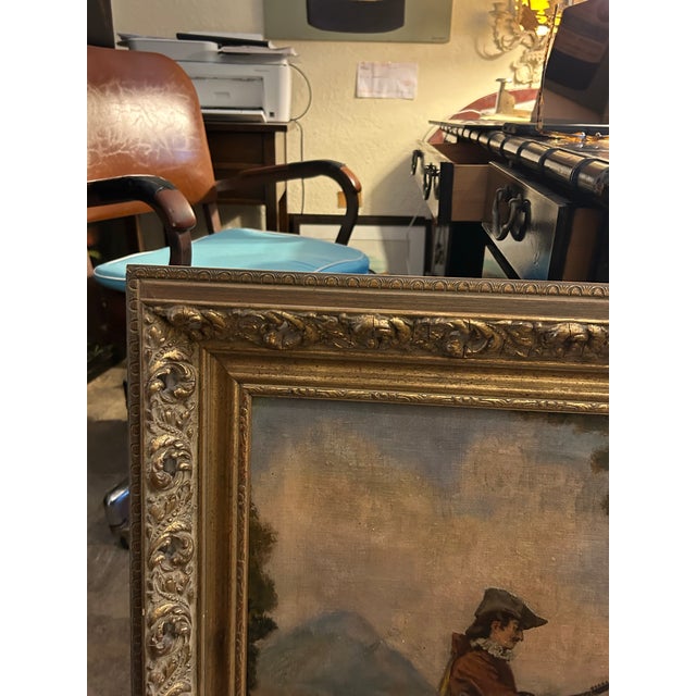 Charming antique oil painting on canvas of a romantic fantasy garden scene with figures. Presented in the original gilt...