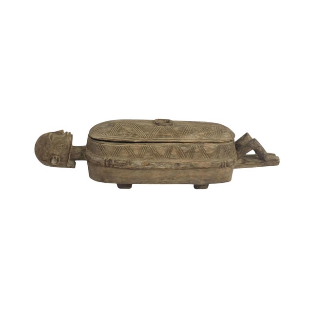 Hand-carved of one piece of wood vintage Dogon ceremonial box from Mali featuring an ancestor figure sculpture....