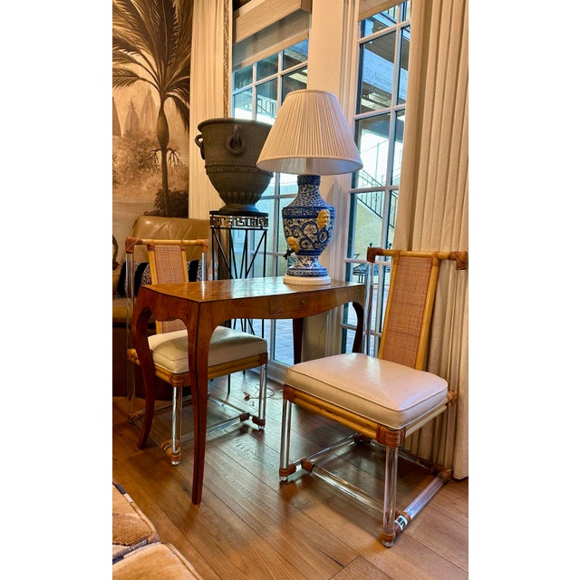 A beautiful large antique ceramic lamp, hand-painted blue-and-white with colorful floral motifs, yellow lion heads and...