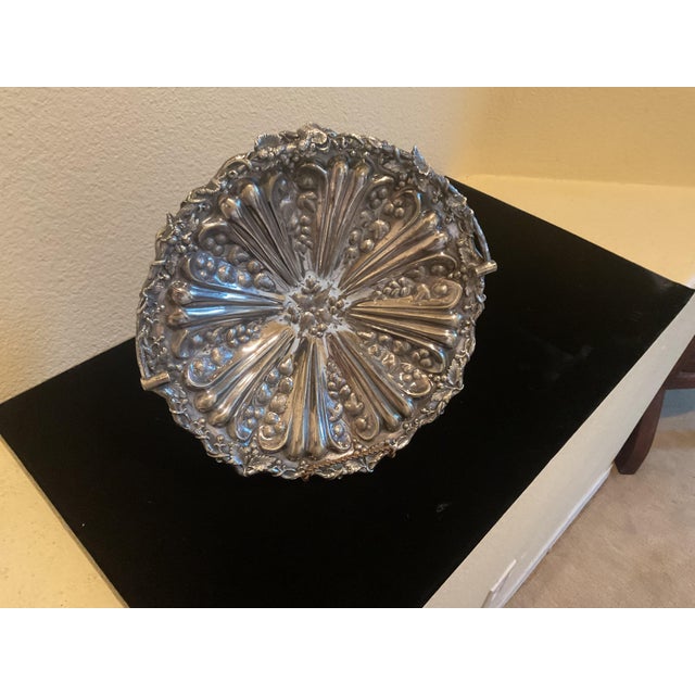 This is an absolutely beautiful silver plated bowl made during the early 20th Century or late 19th Century. It may serve...