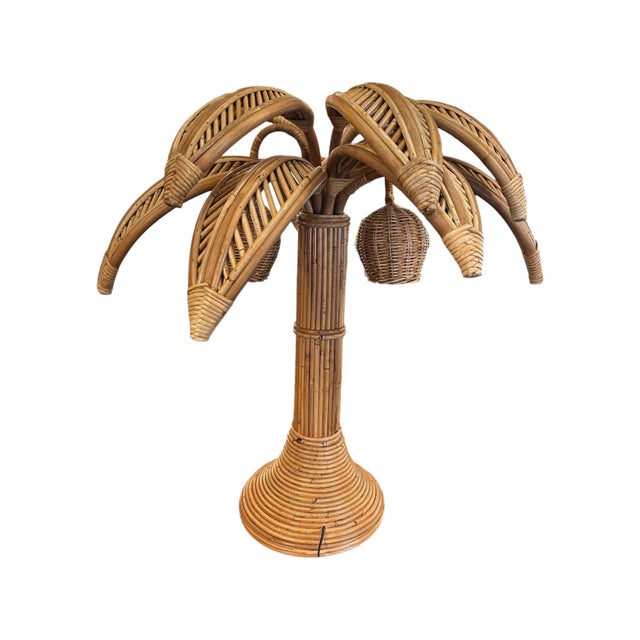 Table lamp in the shape of a palm tree, handcrafted in rattan with two light points that simulate coconuts. European Plug...