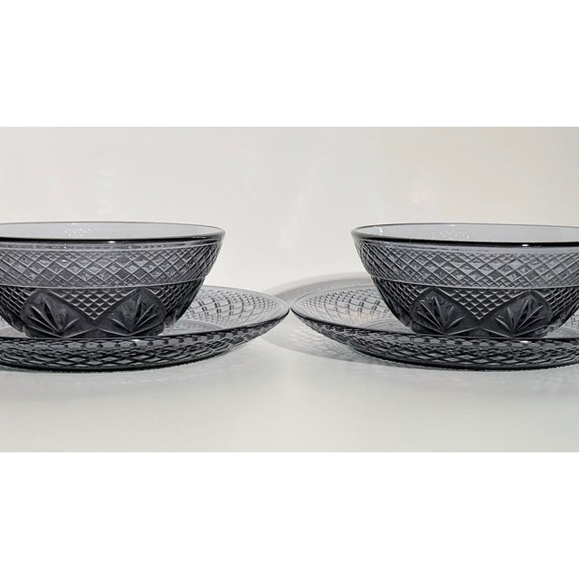 A beautiful French table glass set by Cristal d’Arques Durand in a rich amethyst tone. This four-piece dessert service...