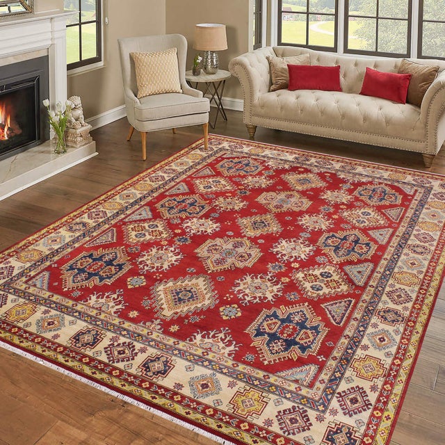 Enhance your home with this exquisite hand-knotted Kazak rug, crafted from fine hand-spun wool and dyed with all-natural...