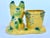 This sweet, petite French Bulldog planter features a yellow and green majolica-style glaze with colorful pops of orange...