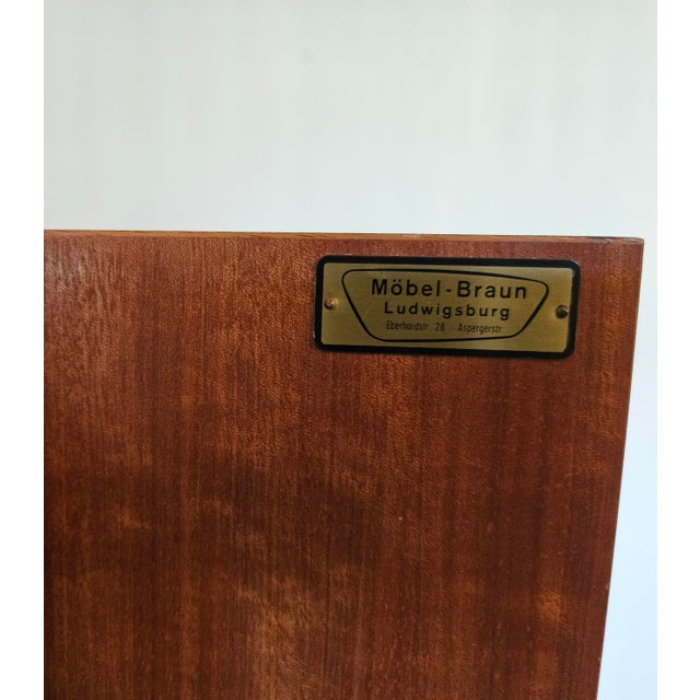 A striking example of West German mid-century modern design, this large-scale dry bar cabinet and display hutch was...