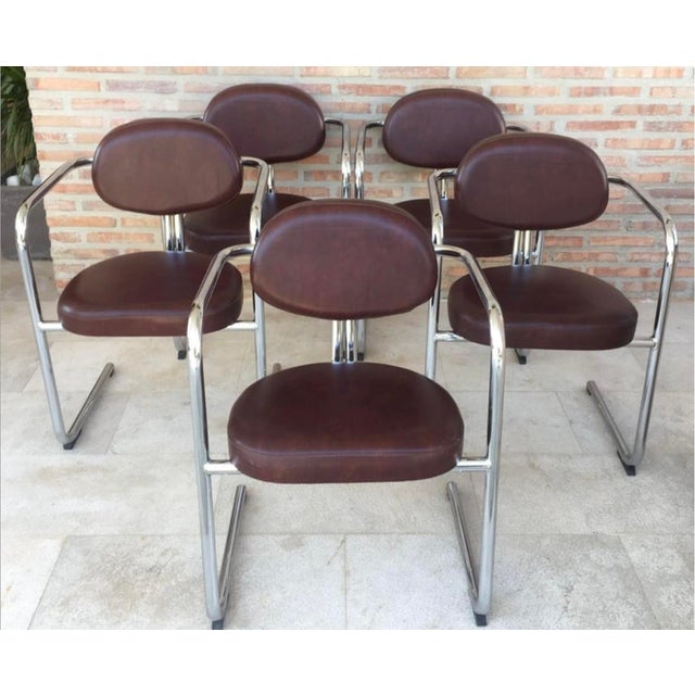 Vintage Italian brown leather and chrome armchairs, 1980s, set of five.