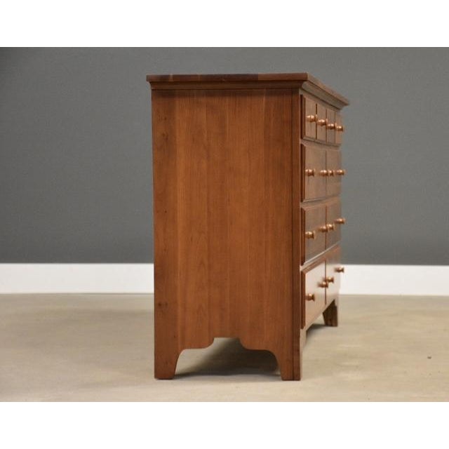 A solid cherry ten drawer dresser with exposed dovetails very well made. Professionally restored. Circa 1990’s. Made in...