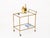 Gorgeous and unique Mid-Century bar cart entirely crafted in faux-bamboo solid brass and completed with crystal shelves....