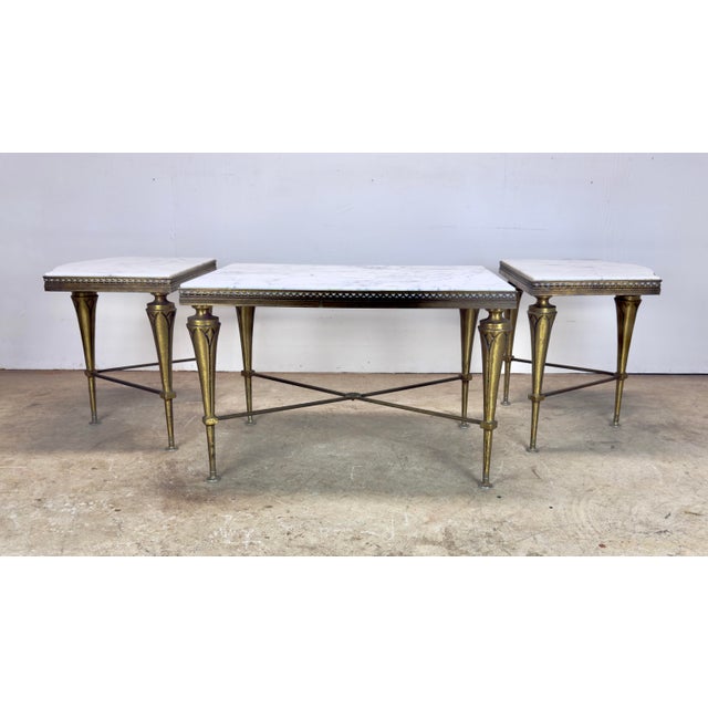 A fabulous mid 20th century set of three Maison Ramsay / Maison Bagues style neoclassical tables with heavy brass finish...