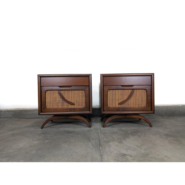 This striking pair of mid-century modern nightstands exemplifies refined craftsmanship and sculptural design. Each...