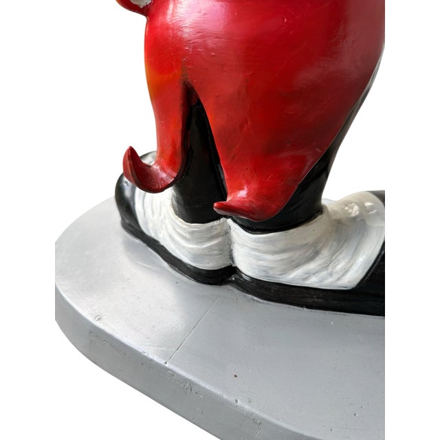 A stunning, high-fidelity piece of "Disneyana" history, this 30-inch Mickey Mouse Butler Valet serves as both a whimsical...