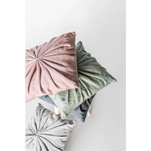 Ami Cushion is made out of natural high quality linen. Its simple yet playful pleated design is inspired by geometrical...