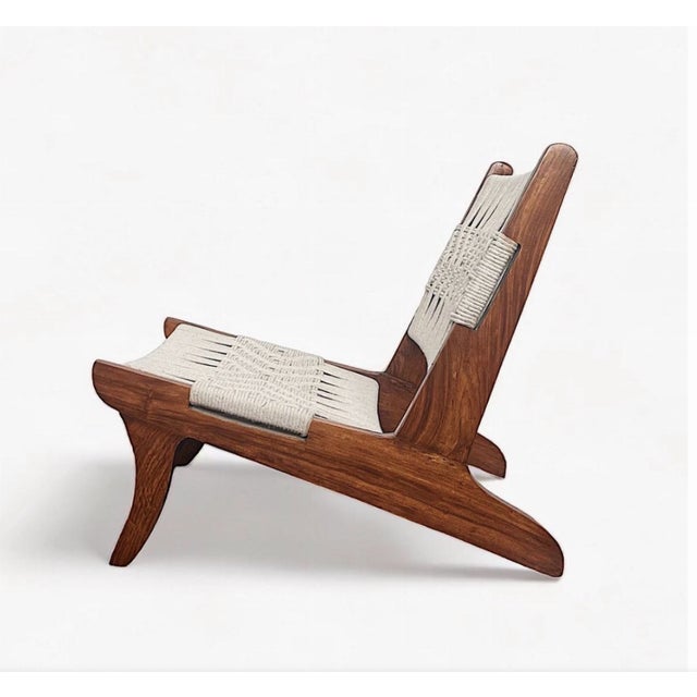 Fantastic teak and rope low lounge chair attributed to Pierre Jeanneret. This was sourced from Chandigarh, India in the...