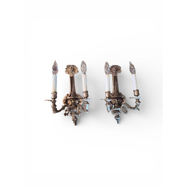 Elevate your space with this exquisite pair of vintage Frederick Cooper gilt wall sconces, beautifully crafted and...