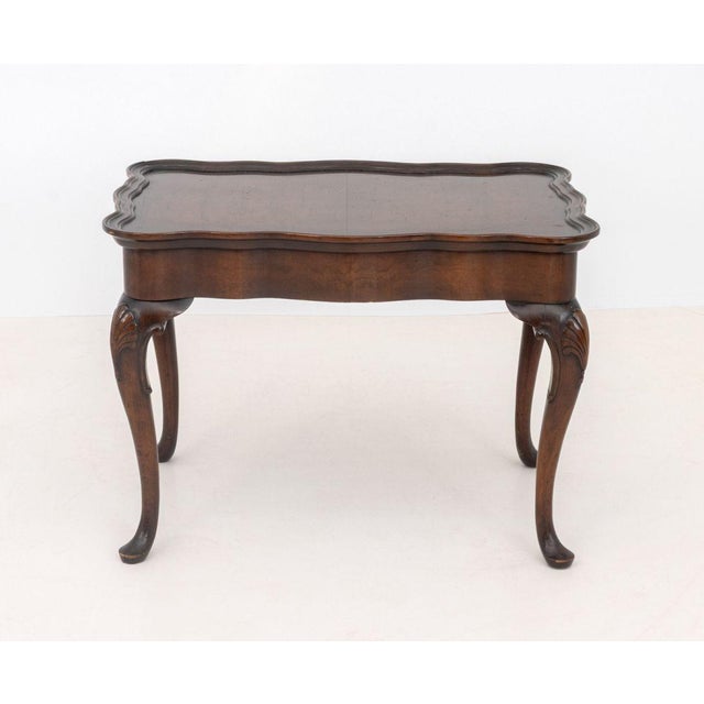 George III Style Mahogany Side Table, the shaped top above four cabriole legs with shell motif carvings. 18.75" H x 25.75"...