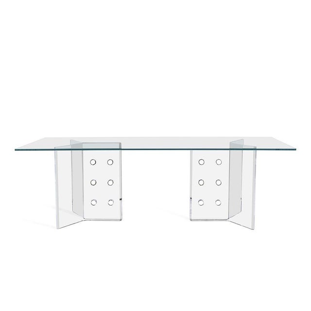 Dining table with domino style acrylic base with glass top. Stunning table adds sophisticated elegance to any living...