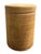 Unmarked round wood side table with a carved, ridged texture and a hollow interior, in a natural blonde finish.