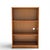 A petite vintage teak bookcase with warm grain, clean lines, and open shelving. Its shallow depth and compact scale make...