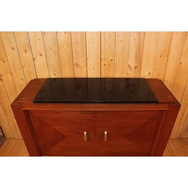 Art Deco period buffet in mahogany veneer and black marble (minimal chips of use) The interior of the buffet has a shelf...