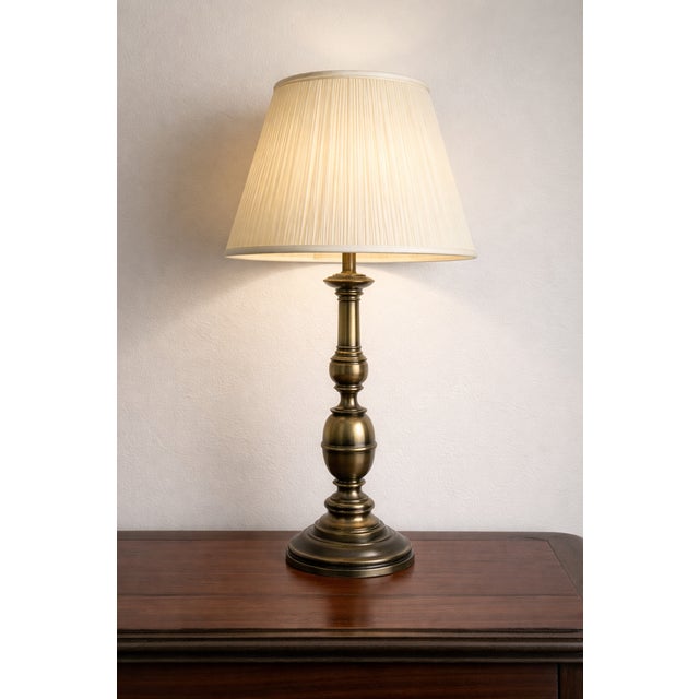 This vintage Stiffel table lamp exemplifies American-made traditional lighting at its best. Crafted from solid brass, the...