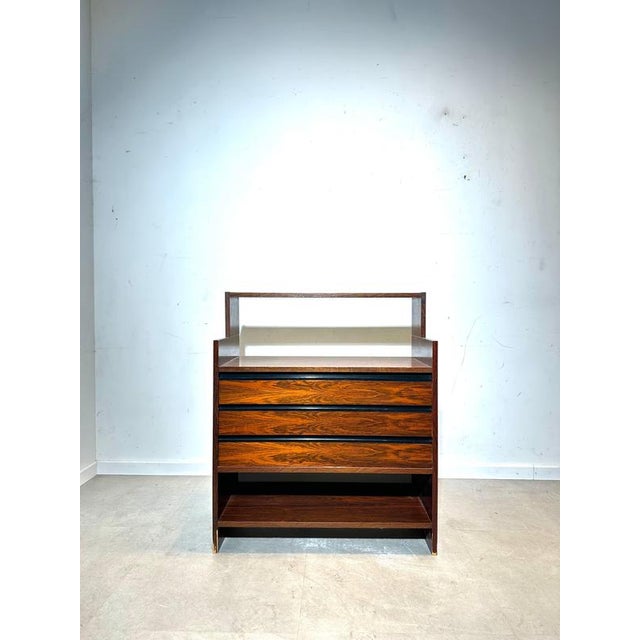 Elegant mid-century cabinet by KLM Systeem, produced in the Netherlands. This functional and well-proportioned piece is...