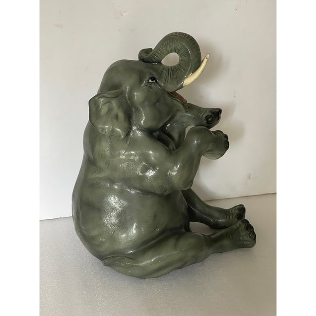 Super cute vintage garden sitting elephant garden figurine.