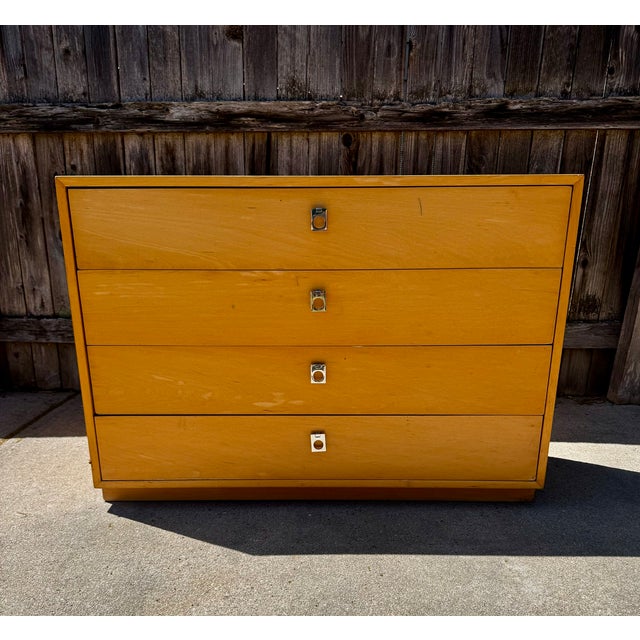 Slender maple dresser with chrome pulls by Jack Cartwright for Founders Furniture. Missing "Founders" sticker but well-...