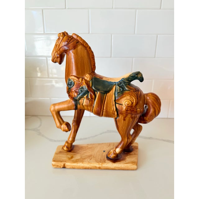 This striking midcentury ceramic horse sculpture captures timeless equestrian elegance with a rich caramel-brown glaze and...
