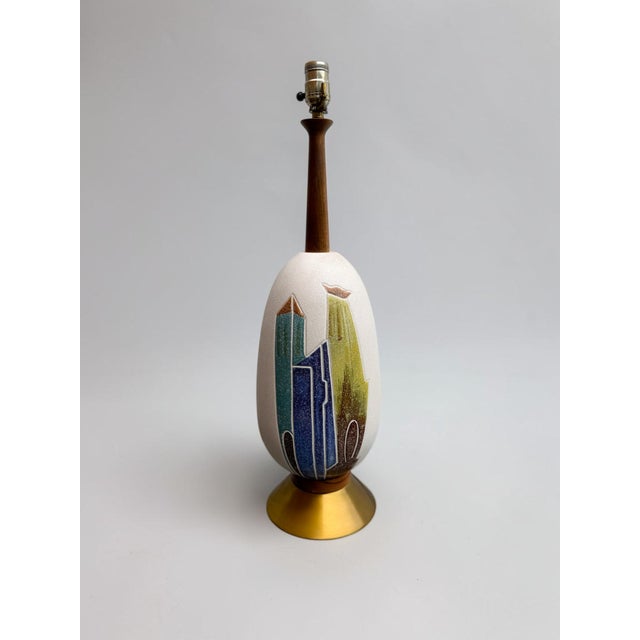 Vintage mid-century modern ceramic table lamp with a sculptural form and geometric architectural decoration in blue, teal,...