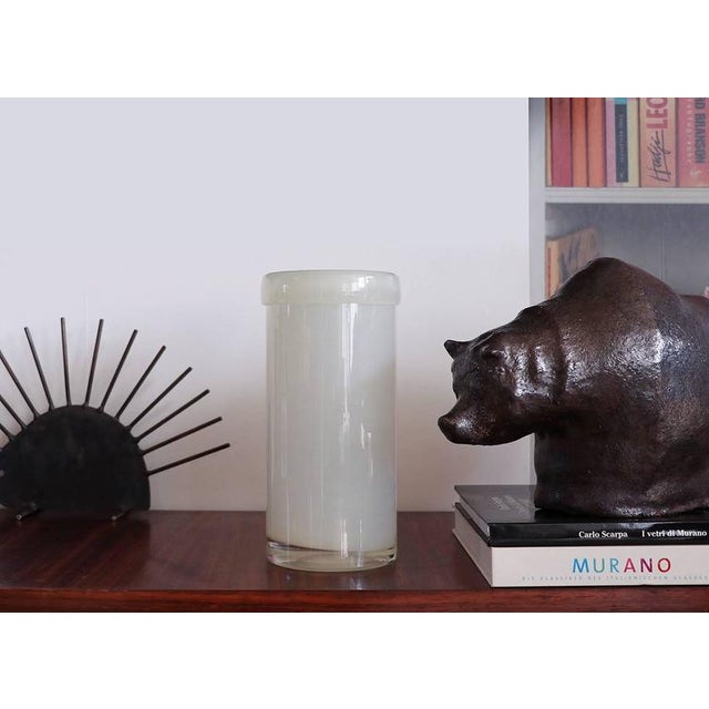 Glass vase made by Erik Hoglund for Kosta Boda, Sweden in the 1960s. Not signed. Small chips at the base. This piece is...