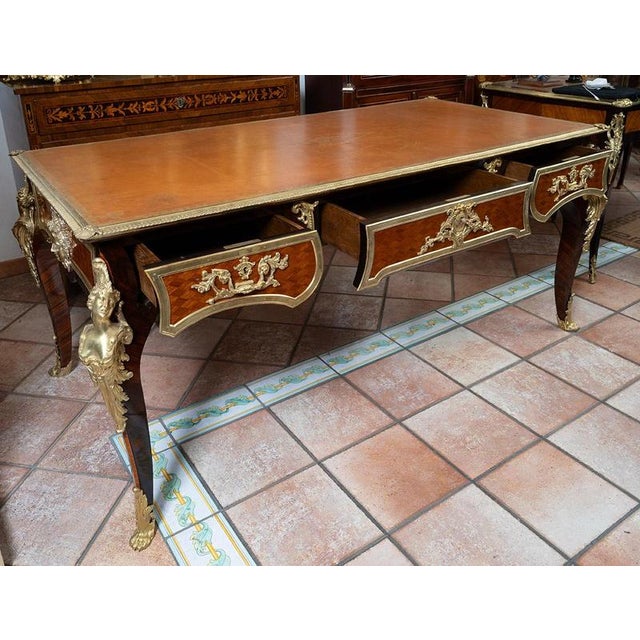 Antique French Napoleon III desk made of fine exotic wood with finely chased gilt-bronze accents. The top features an...