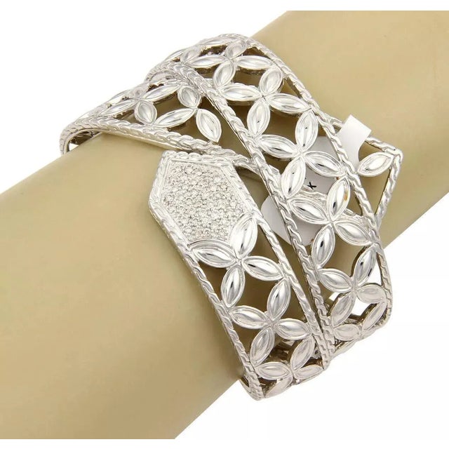 Stunning authentic wide cuff floral band by designer John Hardy from the Kawung Collection, crafted in solid 925 sterling...