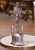 This striking French crucifix, crafted circa 1920, is made of spelter with a silvered finish and presents a richly...