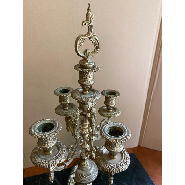 Beautiful rococo style regency candleholder with lions-feet details. Lions head details on seen on the base of the...