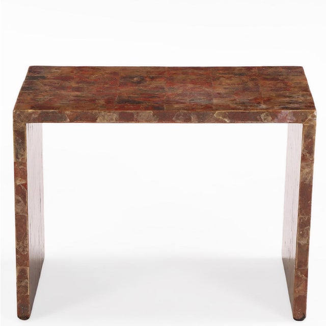 The rectangular top finely inlaid with a shimmering marquetry surface of natural mica, displaying subtle black, brown, and...