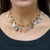 22K yellow gold necklace is strung with faceted rondelle cabochon beads, 8mm to 13mm wide, alternating with 13 multi-...