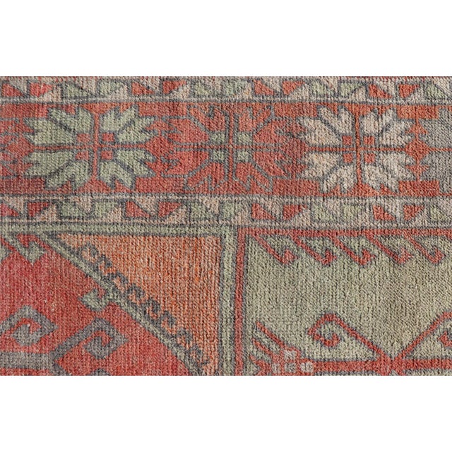 Measures: 5'4 x 11'10. Vintage Turkish Oushak Rug with Soft Coral, Sage Green, and Muted Orange Tones. Keivan Woven Arts /...