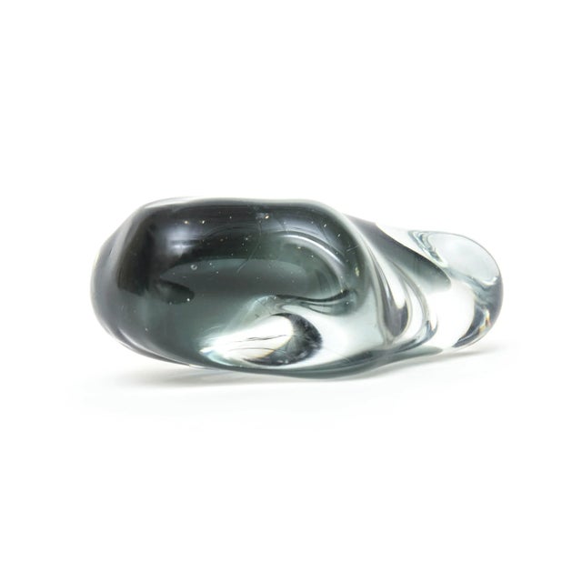 This vintage glass Swedish paperweight sculpture looks like a blob that changes form and colors with the play of light and...