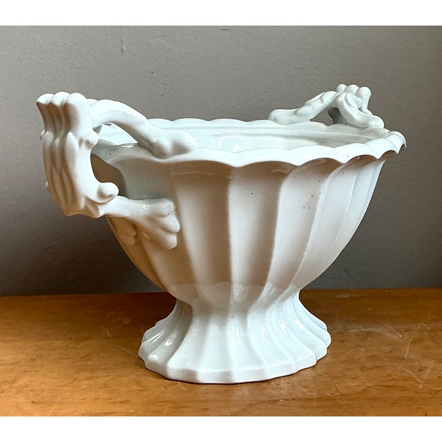 Elegantly crafted in the early 20th century, this Ironstone fluted porcelain footed orchid bowl embodies timeless...