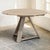 An 18th century Dutch country tilt top table in stripped oak, with a broad round top of wide planks resting on a sturdy...