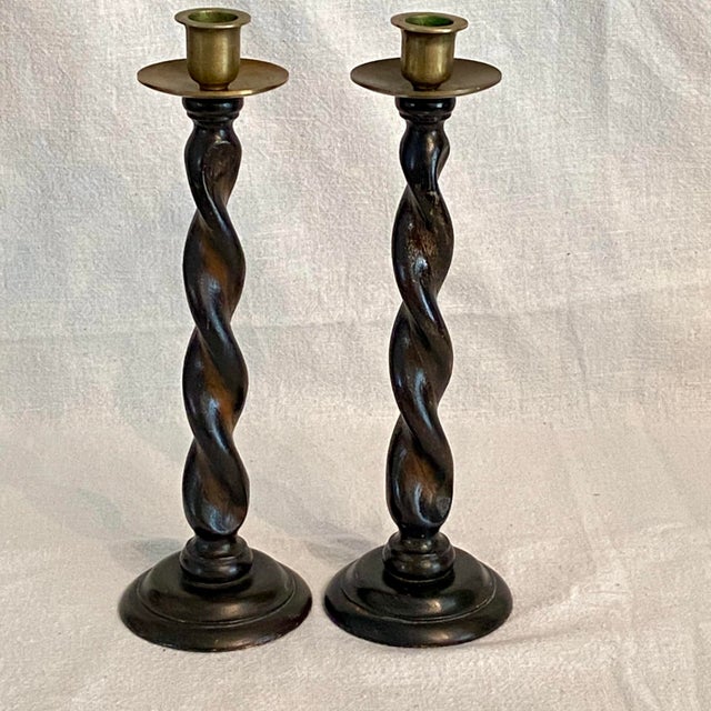 Pair of English oak barley twist candle sticks with removable brass candle cup holders.
