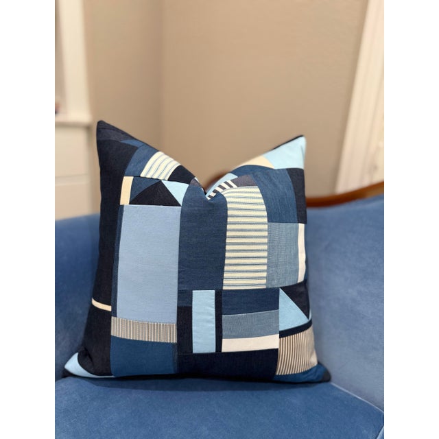The placement of geometric fabric shapes began as a free-form, intuitive exploration when I started to create this pillow....