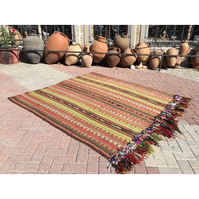 This beautiful, vintage, handwoven kilim is approximately 50 years old. It is handmade, of very fine quality hand spun...