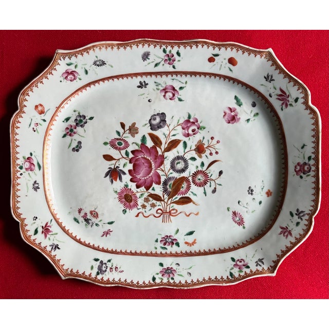 Antique 18th century Chinese export porcelain platter in famille rose palette. Nicely shaped rim; decorated with floral...